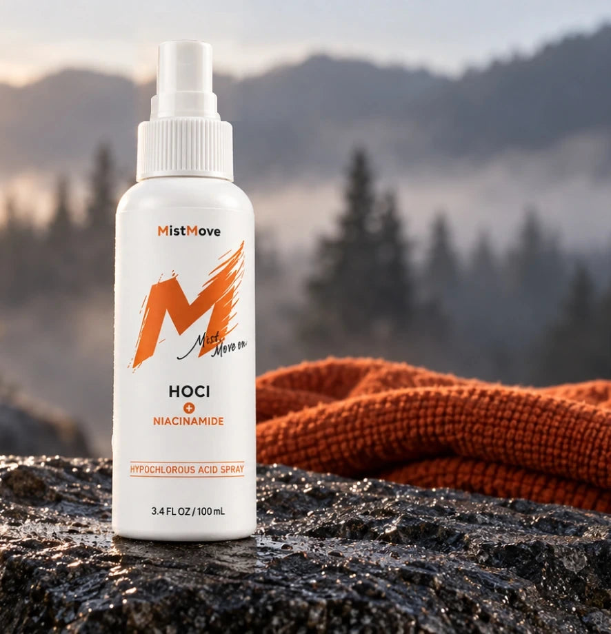 Mistmove bottle and orange knitwear overlooking a mountain trail